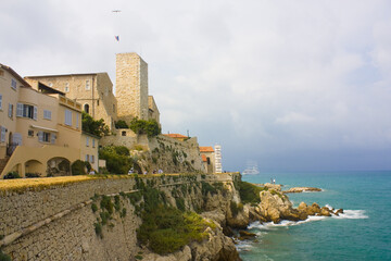 Fototapeta na wymiar Landscape view on the old coastal village and fortification of Bastion Saint Andre in Antibes on the french riviera in France 