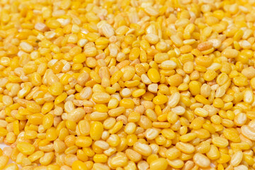 Peeled split mung bean isolated on white background.