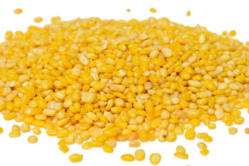 Peeled split mung bean isolated on white background.