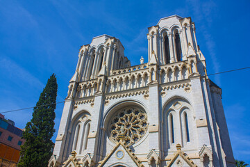 Basilique Notre Dame de Nice is a Roman Catholic Neo-Gothic basilica situated on the Avenue Jean-Medecin in the centre of Nice, France	 - obrazy, fototapety, plakaty