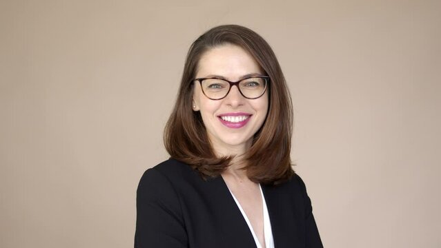 Portrait of a businesswoman with glasses smiling and happy