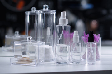 Cosmetic empty bottles and containers. Organizers for cotton swabs and disks. Beauty saloon.