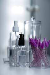 Cosmetic empty bottles and containers. Organizers for cotton swabs and disks. Beauty saloon.