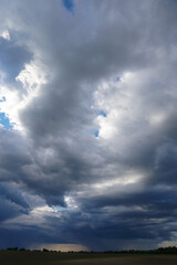 Clouds on the blue sky in sunlight.