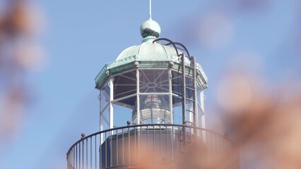 Vintage lighthouse tower, retro light house, old fashioned historic classic beacon, fresnel lens....