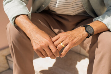 Close-up of African American male hands. Male hands with ring and watch. Human body concept - obrazy, fototapety, plakaty
