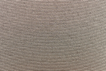 Round metal lines on grainy surface