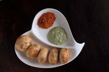 Close up shot of South Indian breakfast dish called Appe and chutney.