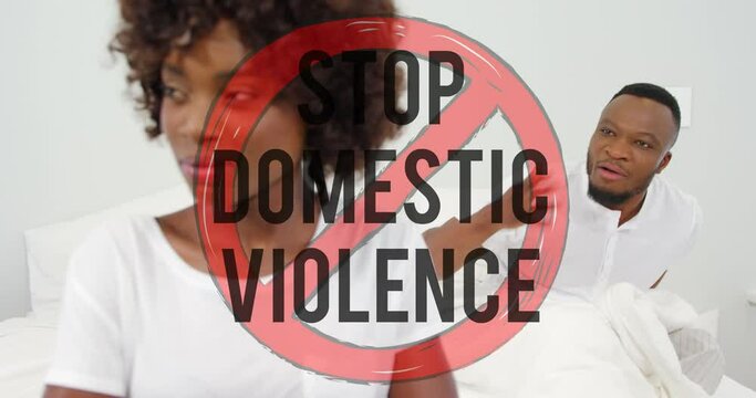 Animation of stop domestic violence text over african american couple arguing