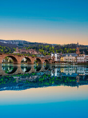 Portrait shot of Karl Theodor Bridge over Neckar river and Heidelberg old town in Germany © Arnold