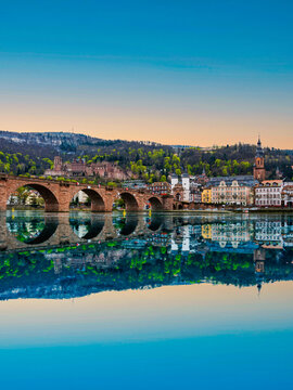Portrait shot of Karl Theodor Bridge over Neckar river and Heidelberg old town in Germany