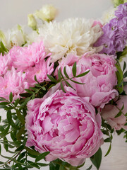 Pink peonies close-up for a website, greeting card, catalog or online store. The concept of flower shop. Flower delivery