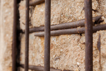 rusty iron on stone wall