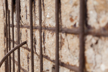 rusty iron on stone wall