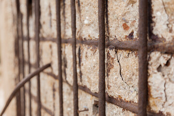rusty iron on stone wall