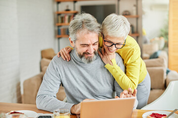 senior couple happy laptop computer love together elderly love man woman shopping