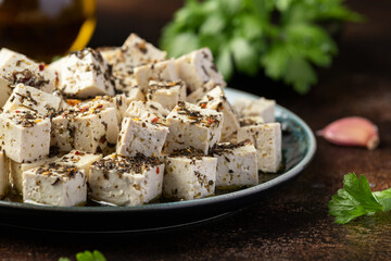Vegan Tofu feta cheese with dried oregano, basil, thyme and garlic. Healthy Food.