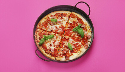 Pizza on pink background.