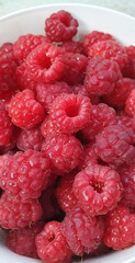 Fresh and sweet raspberries background. Raspberry harvest. Close-up.