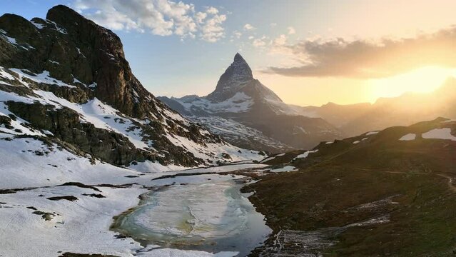 majestic mountain peak of Matterhorn, symbol of Switzerland, aerial view of beautiful sunset near Matterhorn, Swiss nature and tourism in Switzerland 