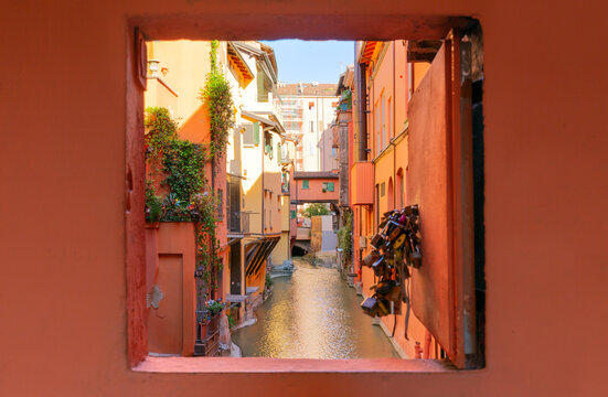 Fototapeta Secret window in the wall to the hidden part of the city in Bologna, Italy. Canal of Reno in Piella street