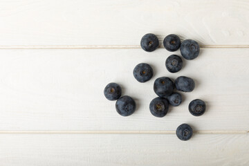 Blueberries on a light texture background. Ripe and fresh blueberries. Vitamins. Healthy food. Juicy berry.Copy space.Place for text