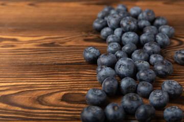 Blueberries on a brown texture background. Ripe and fresh blueberries. Vitamins. Healthy food. Juicy berry.Copy space.Place for text