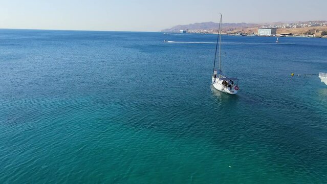 Panning Shot Of Tourists Exploring Red Sea In Yacht During Vacation On Sunny Day - Eilat, Israel