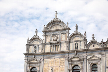 Fototapeta na wymiar Beautiful marble facade of The St. John and Paul hospital in Venice. Close-up of decorated grand hospital.