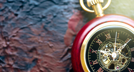 Fototapeta premium Pocket watch on the black background 
