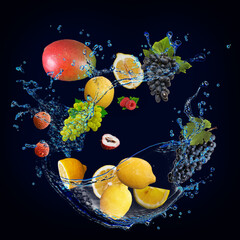 Panorama, wallpaper with fruits in water - fresh mango, lemon, grapes, lychees, raspberries are...