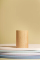 Minimalist wooden scene. Abstract minimal empty stage. Wooden cylinder on beige background. Mockups display for product presentation.