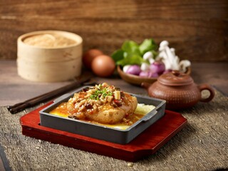 Hot Plate Tofu with Preserved Cai Xin and Minced Pork served in a dish isolated on mat side view on grey background