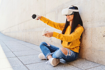 Young Asian woman using VR set for metaverse