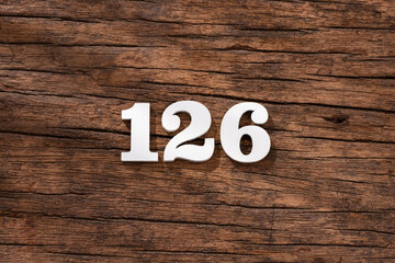Number 126 - piece on rustic wood background