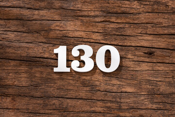 Number 130 - piece on rustic wood background