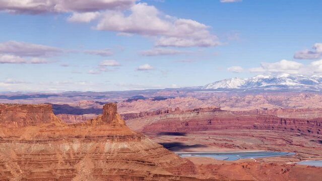 Time Lapse of the clouds moving above the rugged landscape near Canyonlands National Park in Moab Utah.
