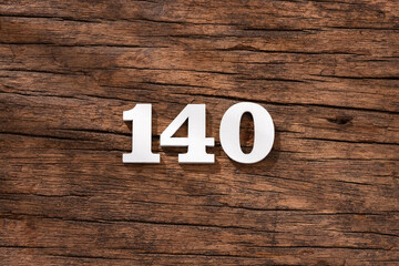 Number 140 - piece on rustic wood background