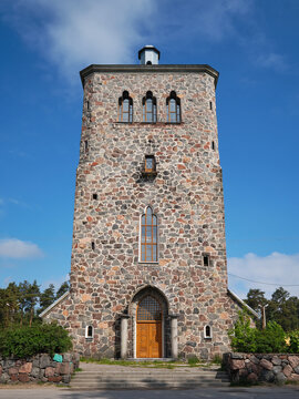 Finnish Lutheran church Kakisalmi in Priozersk against blue sky on a summer sunny day.