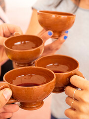 hands of friends with cup of wine