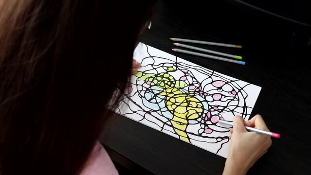 Woman drawing a picture of neurographics.