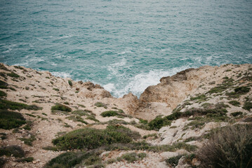 A rocky sea coast at sunset in Valencia.