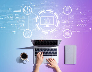 Fintech theme with person using a laptop computer