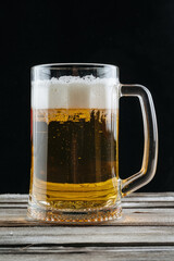 Glasses with beer on wooden background