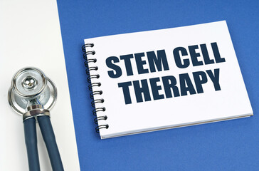 On a blue-white surface lies a stethoscope and a notepad with the inscription - STEM CELL THERAPY