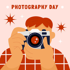 Guy taking a photo. Redheaded male photographer shooting with a camera in a checkered shirt. World photography day. Flat hand drawn cartoon vector illustration