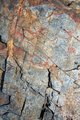 rock background with straight lines texture and different shades of blue and ochre, background.