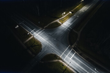 road intersection at night aerial view - obrazy, fototapety, plakaty