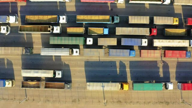 A huge queue of trucks loaded with grain crops in a blocked Ukrainian port. Humanitarian crisis due to the war.