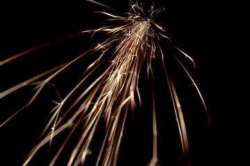 sparks in the dark. lines of light.